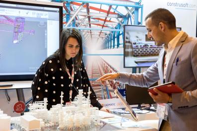 Visitors observing a model of an installation