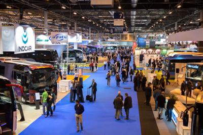 General view of the FIAA trade fair with buses and visitors.