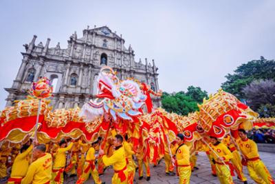 Performance by a group in Macao in front of a religious building.