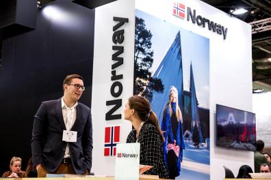 People speaking at the Norwegian pavilion