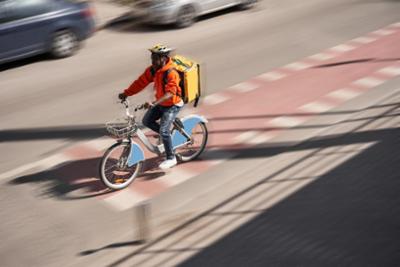 Bicyclist rides his bike along a cycle lane