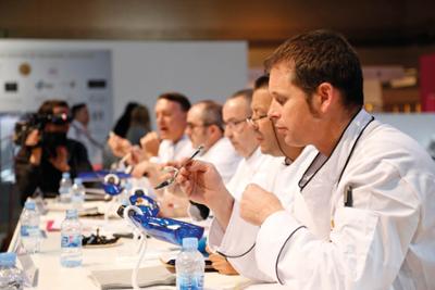 jury group of five men in white coats tasting ice-cream