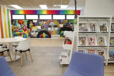 San Fermín Library with mural by urban artist Okuda San Miguel