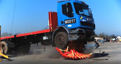 Pitagone mobile barrier stopping a truck