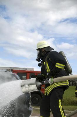 Firefighter throwing water with foam