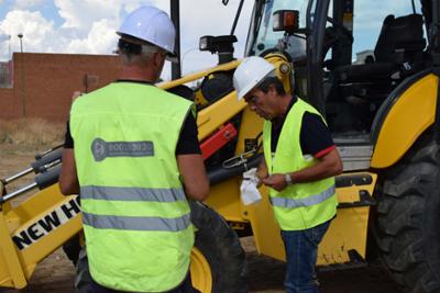 Two workers at work on the construction site