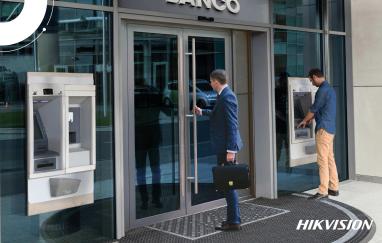 One person entering a bank and another interacting at an ATM of the same entity.