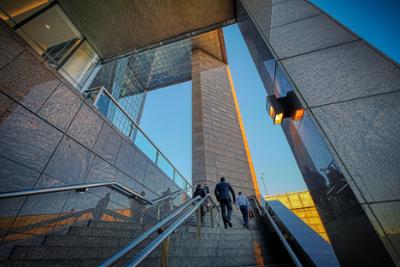 Workers entering a business building