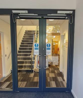 Pedestrian swing doors with Forsa automation