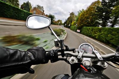 partial view of a motorcycle riding on a highway